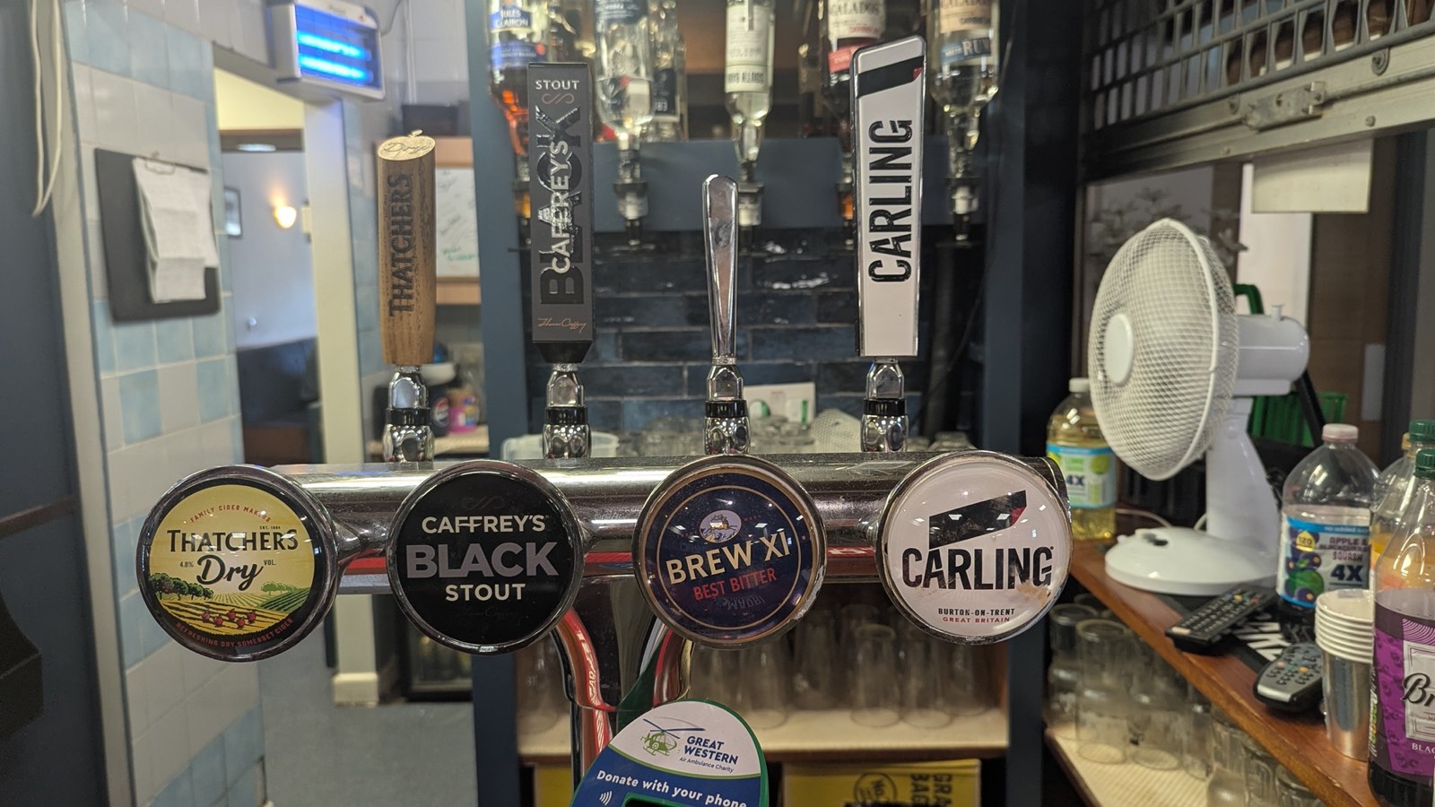 Real ale, stout, cider and lager taps at the bar