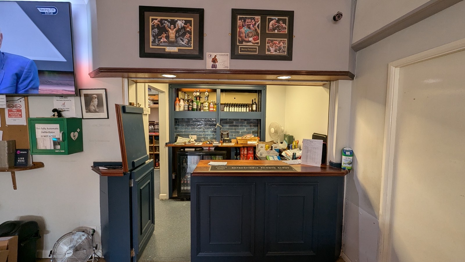 The small bar, with boxing memorabilia on the wall
